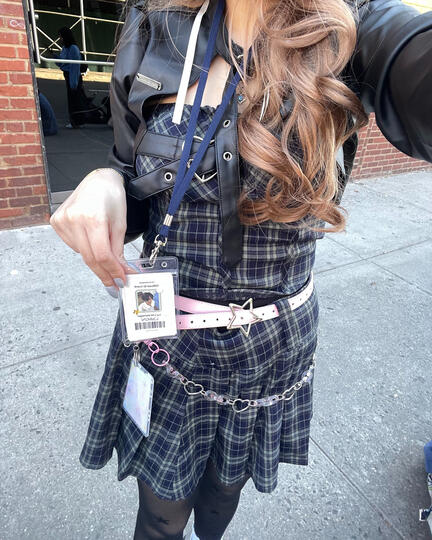 badge worn on lanyard at concert